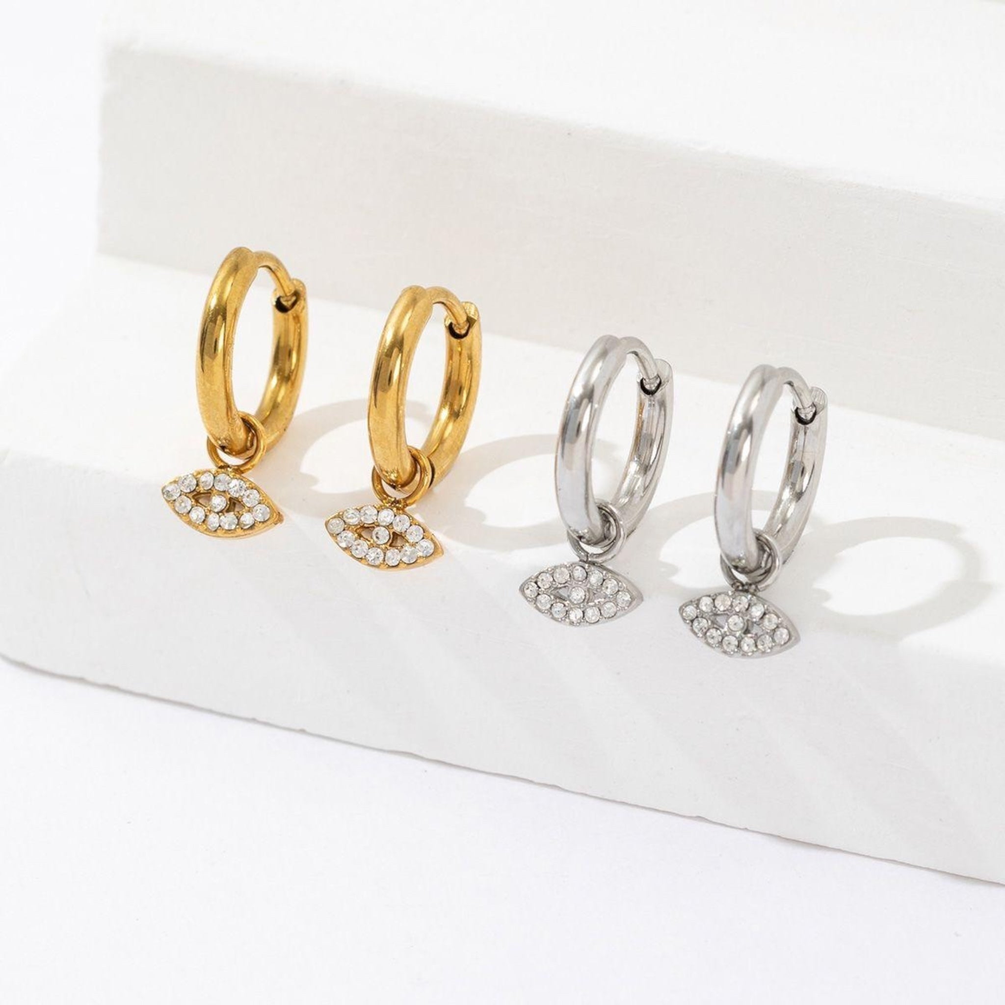 Eye dangle earrings