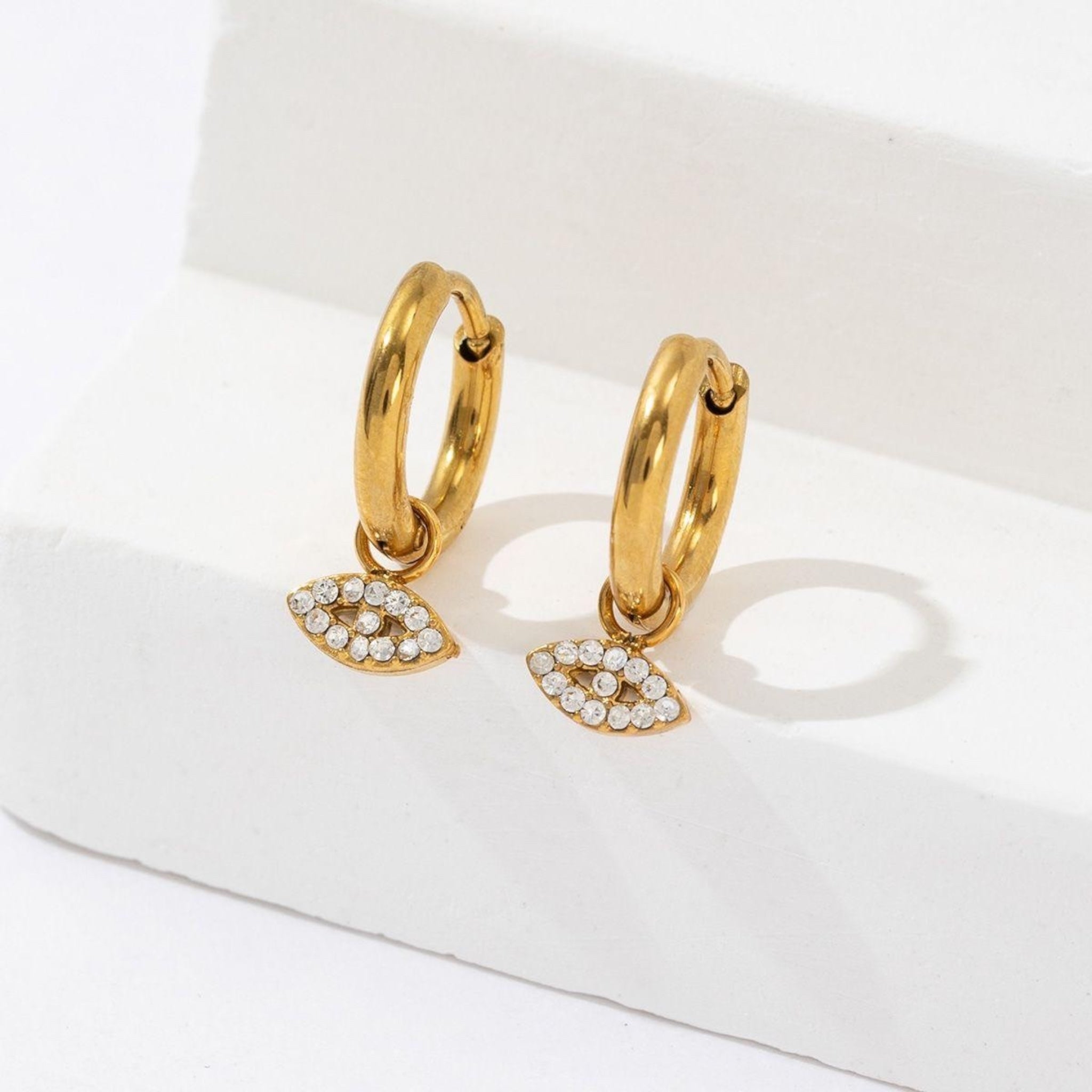Eye dangle earrings