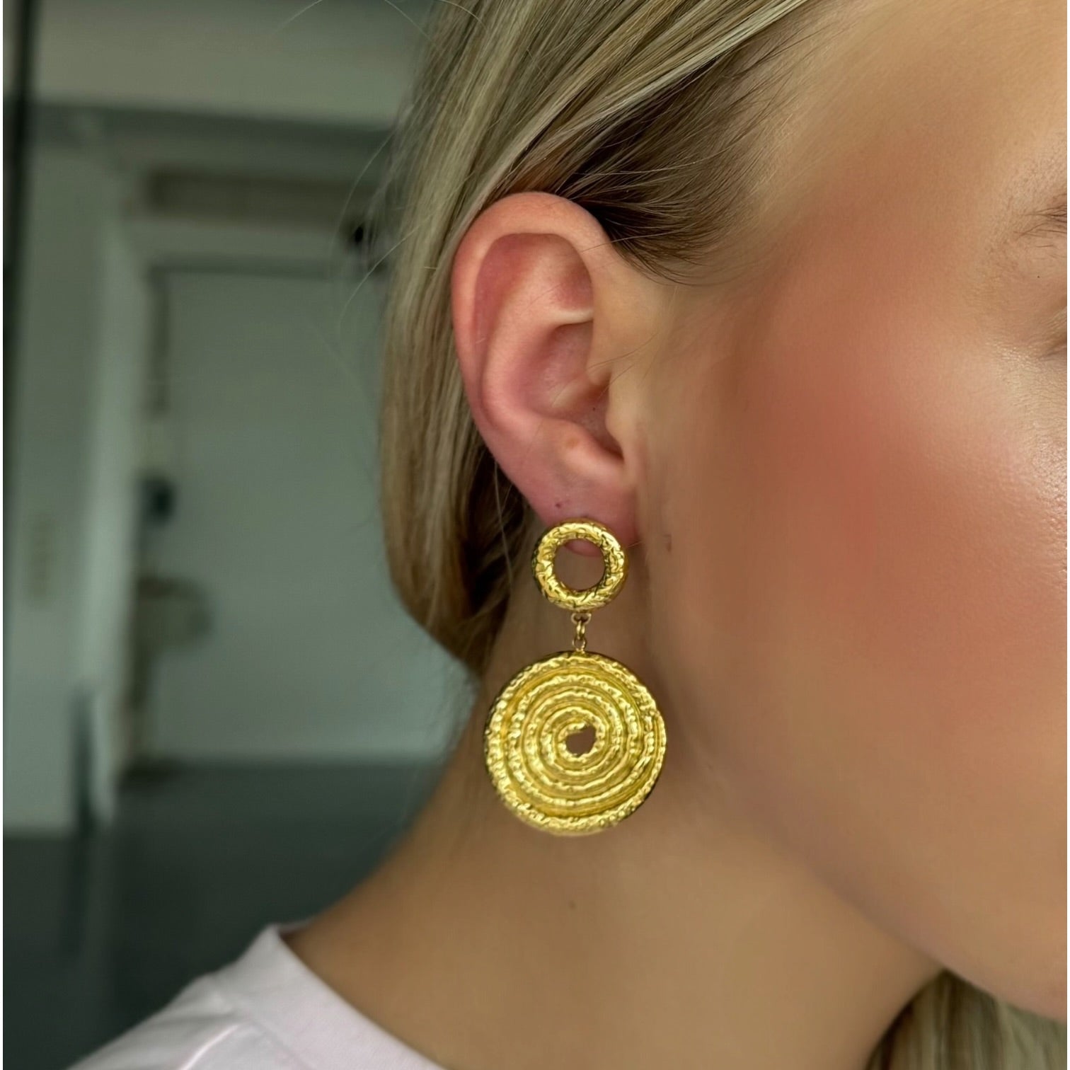 Hanging spiral statement earrings